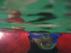 Over/under shot of four year-old Jake on his first snorkel! by John Taylor 
